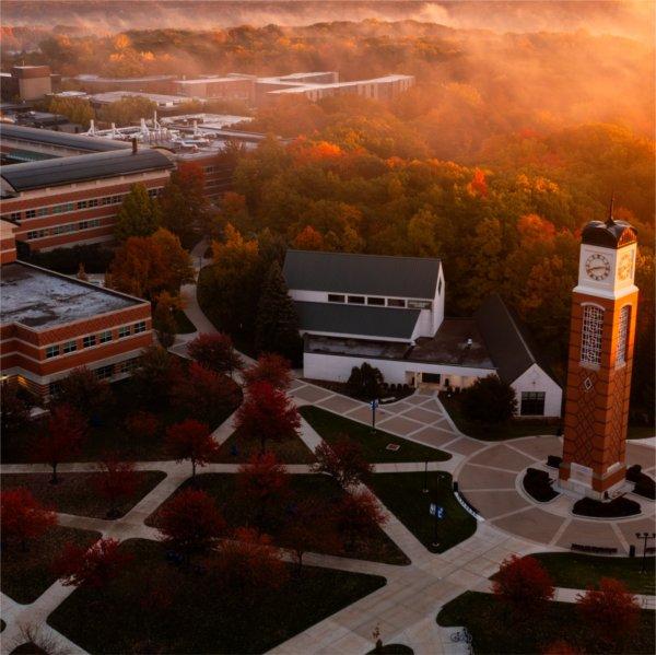 The carillon is at the center of an image of the Allendale Campus during sunrise.