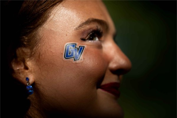  An up close photo of a GV sticker on a student's cheek. 
